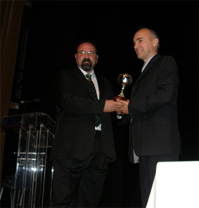 Here we go: PC awarded by Mico Martic as best national team coach of the world 2008 - Dimitri Nicolaou Award