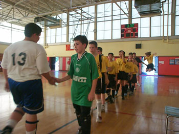 Team Portugal shaking hands with Team Italy following (Photo courtesy: www.kinnane.com/cyffutsal_home.htm)