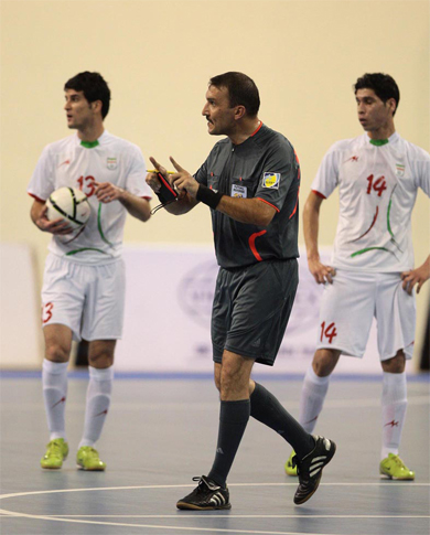 Baratov on the international stage, here with two iranian players (Photo courtesy: Turkmenistan FA)