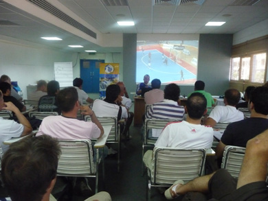 33 coaches focusing on the screen (Photo courtesy: Yiannis Vakis - Futsal Cyprus)