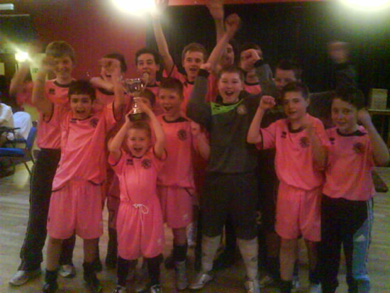 Arran Bollands (Lewis* younger brother) holds the trophy aloft as Boro celebrate (Photo courtesy: Middlesbrough FC)