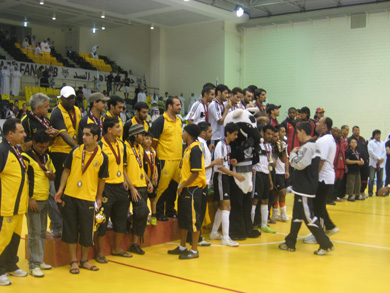 Awarding ceremony: Al Sadd Winners (in white and black), runners up Al-Rayyan (red shirt) and third classified Qatar Sports Club (in yellow) (Photo courtesy: Rubio Guerra)