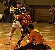Cristian Acua, UAA goalkeeper,  save a ball while his team mate Andrs Len and Ismael Brtez (Olimpia) are looking at him (Photo courtesy: Diario ABC Color)