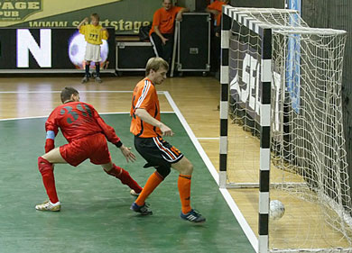 Volodymyr Deynega and Toligma's keeper Alexei Capsamun looking at the ball in the Moldovan goal... (Photo courtesy: Miklos Biszkup)